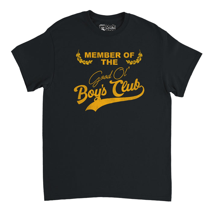 A vintage, black 80s style t-shirt that says "Member of the Good Ol' Boy's Club" in yellow text with golden leaves framing the top, referencing alumni associations, networks of social and business connections from prestigious boarding schools, and social elites in general or those in charge who have power.
