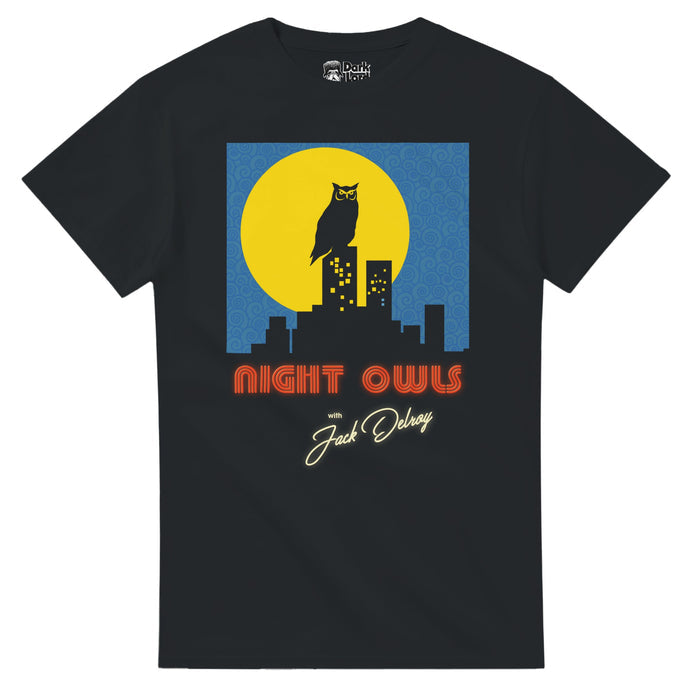 A retro, black colored 80s style vintage short sleeved t-shirt that says "Night Owls with Jack Delroy" underneath a square image of an owl standing on the top of a building in a city skyline, a bright yellow large circular moon behind him against a blue sky filled with swirls. References the 2023 indie horror film "Late Night with the Devil" which centers on late night talk show "Night Owls with Jack Delroy" in the 1970s which stars David Dastmalchian as Jack Delroy and Ingrid Torelli as Lilly D