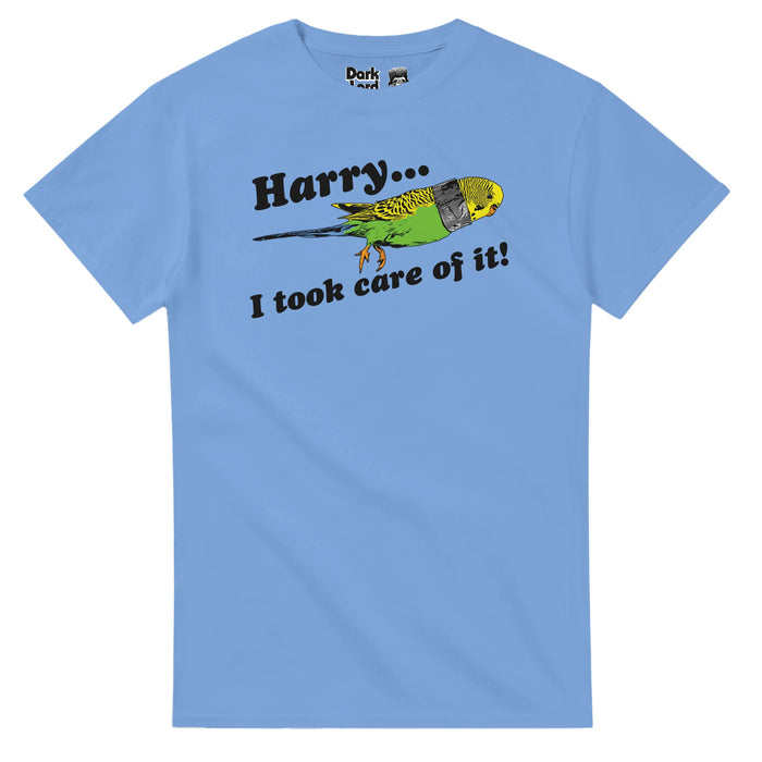 A light blue, vintage, 70s style t-shirt that says "Harry... I took care of it!" with the image of a yellow and green parakeet bird, a piece of tape around its neck. References the iconic scene from the 1994 screwball comedy "Dumb and Dumber" in which Petey the bird dies but character Lloyd Christmas (Jim Carrey) fixes it all by taping back on its decapitated head and telling Harry Dunne (Jeff Daniels) that he fixed it.