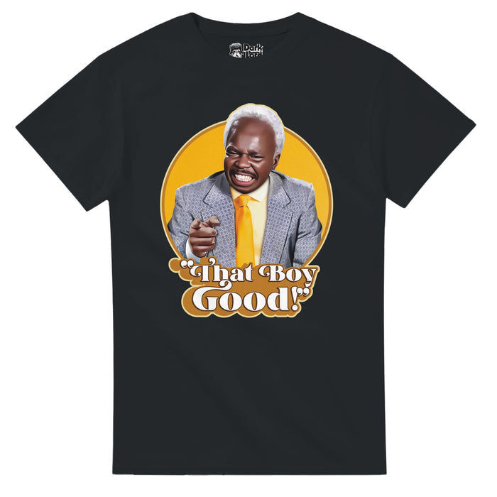 A black colored, 70s style retro t-shirt that says "That Boy Good!" underneath an image of actor Clint Smith wearing a blue suit and yellow tie, smiling against a circular yellow background. References the 1988 comedy romance film "Coming to America" and a short clip in which the character Sweets, played by Clint Smith, says "That Boy Good!" in excitement to see Randy Watson, played by Eddie Murphy, the iconic soul singer.