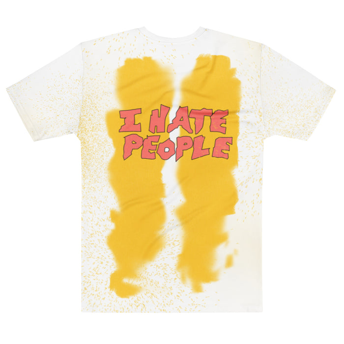A vintage, 80s style souvenir t-shirt with two large yellow stains and tons of smaller yellow splotches with the bubble letter text in red that says "I HATE PEOPLE". References the popular, iconic song released by Anti-Nowhere League punk rock band in 1982.