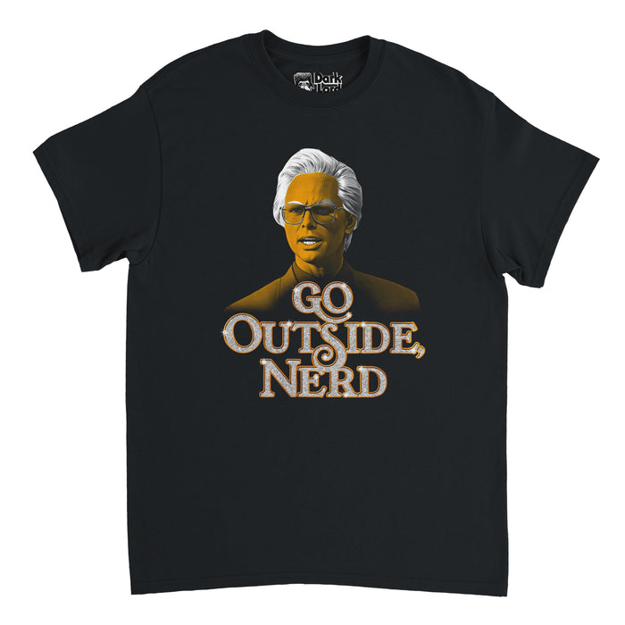 A black colored 80s style short sleeved vintage t-shirt with an image of actor Walton Goggins as character Baby Billy Freeman, his face yellow and hair bright white wearing glasses and a suit above his quote "GO OUTSIDE, NERD" in sparkly white bubble letters. In reference to the crime comedy drama tv series "The Righteous Gemstones" created by Danny McBride that stars Edi Patterson, Danny McBride, John Goodman, Adam DeVine, Cassidy Freeman, and Tony Cavalero.