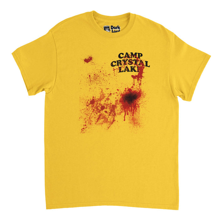 A retro, souvenir Camp Crystal Lake t-shirt in the color yellow with blood stains on it, referencing the 1980s horror movie "Friday the 13th" in which camp counselors are hunted and murdered on the campgrounds of "Camp Crystal Lake". Can be warn as a Halloween costume.