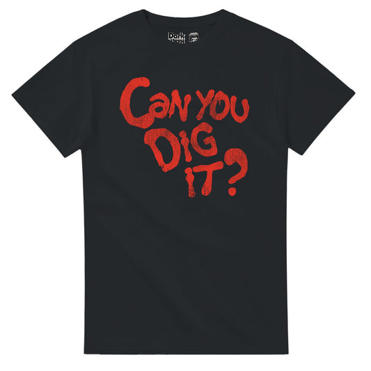 A retro, 80s style black colored souvenir t-shirt that says "Can You Dig It?" in bright red letters in a creepy horror like font that references the iconic quote from the action thriller 1979 film "The Warriors", a New York gang epic, spoken by character Cyrus, played by famous actor Roger Hill and also made famous by legendary pro wrestler Booker T from his theme song "Can You Dig It Sucka".