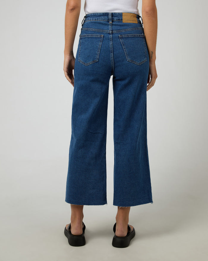 Women's mid-blue high-waisted wide-leg jeans