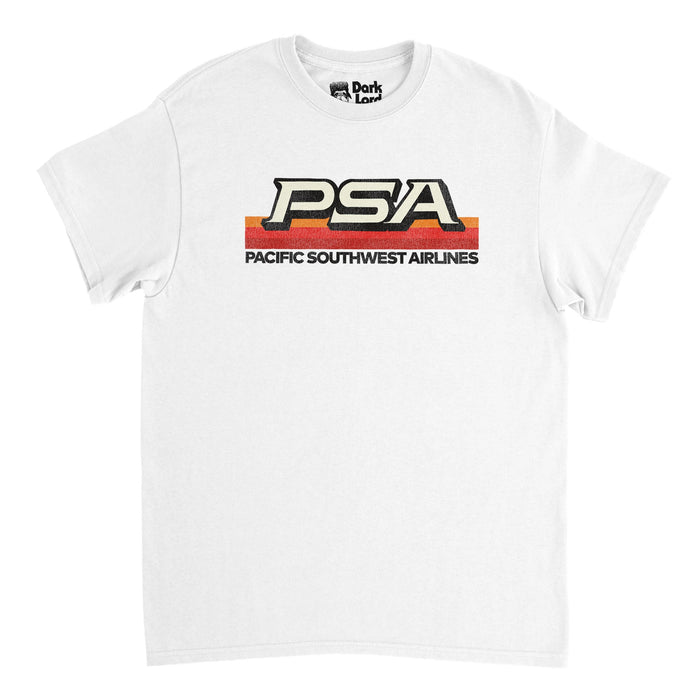 A retro, 80s style white t-shirt that says "PSA" and "Pacific Southwest Airlines"on top of three stripes one orange, one red, and one maroon. References the low cost airline headquartered in San Diego, California which operated from the years 1949-1988.