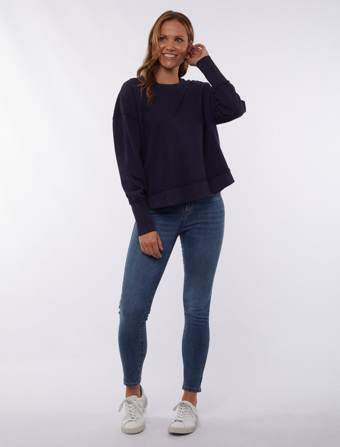 Women’s navy sweatshirt with curved hem