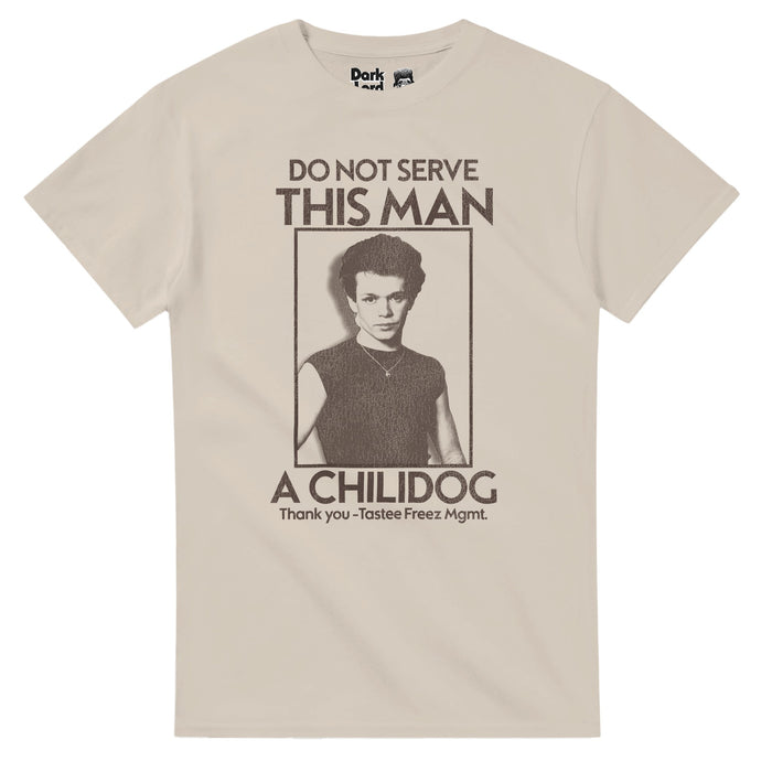 A retro sand colored light brown retro 80s style t-shirt that says "Do not serve this man a chilidog, Thank you - Tastee Freez Mgmt." in brown capitalized test with an image of heartland rock style and folksy rock singer and songwriter John Mellencamp in a rectangle outlined in brown. References John Cougar Mellencamp's iconic song "Jack & Diane", and the music video in which Diane sits on Jack's lap outside a Tastee Freez with a chilidog.