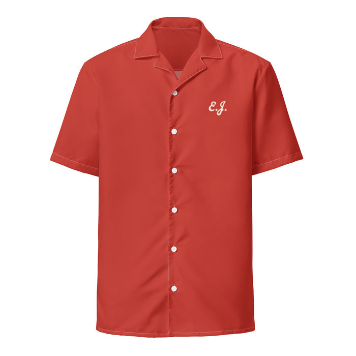 The front of a dark orange red, retro, souvenir button up collared short sleeved costume shirt with the letters "E.J." Worn by Donny, played by iconic actor Steve Buscemi, in the hilarious, popular 1998 film "The Big Lebowski".