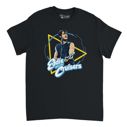 A retro short sleeved black t-shirt that says Eddie and the Cruisers underneath an image of Eddie Wilson in a black tank top singing at a microphone with a guitar. References the 1983 American musical drama film "Eddie and the Cruisers"directed by Martin Davidson, based on the P. F. Kluge novel, starring Tom Berenger and Michael Paré.