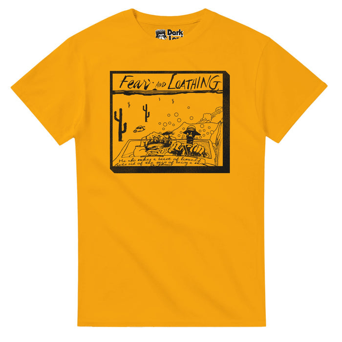 A mustard yellow colored vintage "Fear and Loathing in Las Vegas" souvenir t-shirt that says "Fear and Loathing" and highlights the Samuel "Dr. Johnson" quote "He who makes a beast of himself gets rid of the pain of being a man" as well as a sketched image of a car racing through the cacti filled Mojave Desert, exhaust fumes and bubbles and a cow with sunglasses in the distance, two men driving - characters Dr. Gonzo and Raoul Duke played by iconic actors Benicio del Toro and Johnny Depp.