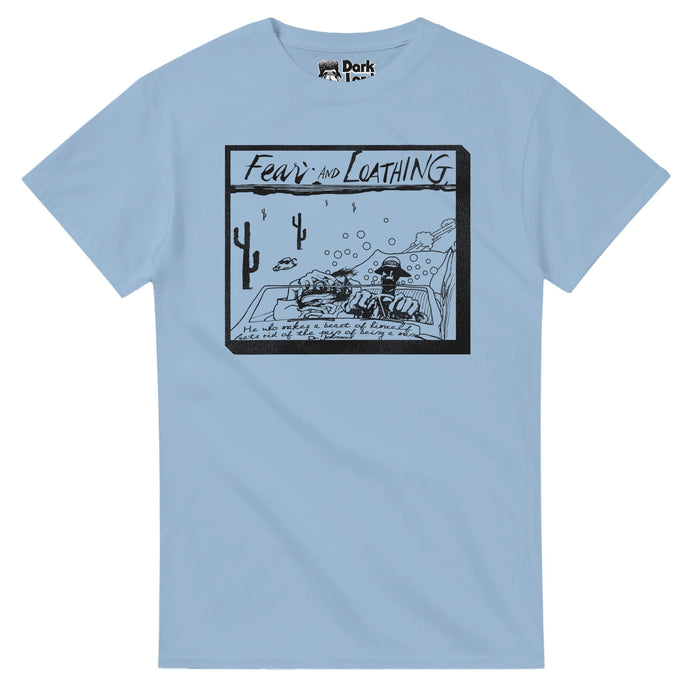 A light blue vintage t-shirt with a box saying "Fear and Loathing" and the Samuel Jackson quote "He who makes a beast of himself gets rid of the pain of being a man, Dr. Johnson" as well as the image of two guys (Johnny Depp as Raoul Duke and Benicio del Toro as Dr. Gonzo) driving through the cacti filled Mojave Desert, exhaust, gas, and bubbles coming out of their speeding car, a cow with sunglasses in the distance. References "Fear and Loathing in Las Vegas", an adventure film based on Thompso