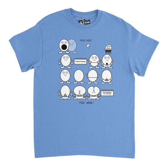 A vintage, 70s style carolina blue colored t-shirt. Shirt says "40 eggs" under the image of a basket of eggs to be eaten, "Feed Eggs" above an open mouthed egg, waiting to be fed, "Congrats big boy" next to an egg with its pants down, and "You're looking at a nude egg" next to an egg with its butt showing, and "You Won!" at the bottom. References the iconic 'Eggman Game' from the comedy television sketch "I Think You Should Leave with Tim Robinson" created by Time Robinson and Zach Kanin.