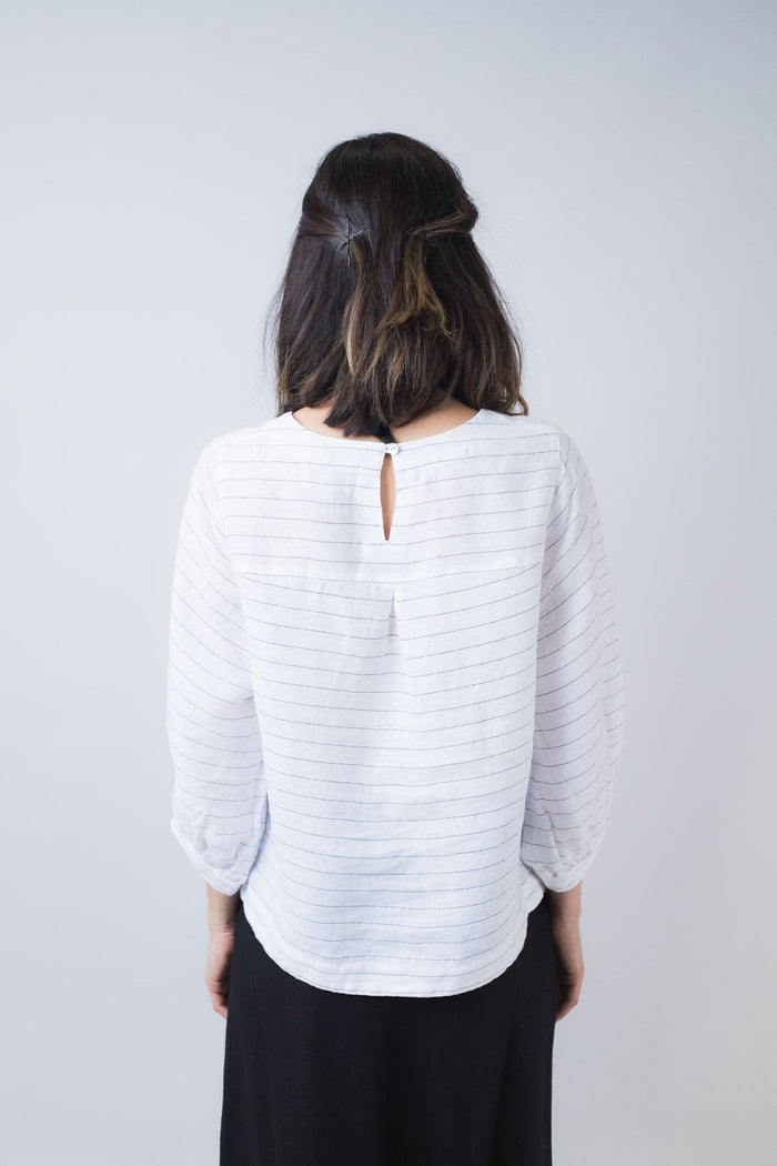 Women's white pinstripe blouse with a round neckline