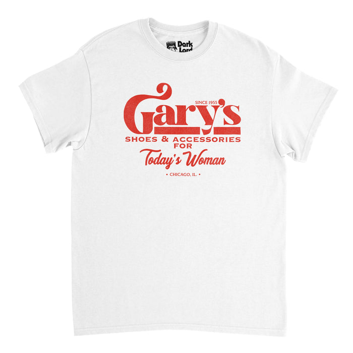 A retro, souvenir white colored t-shirt that says 'Gary's Shoes & Accessories For Today's Woman' in 'Chicago, IL', 'Since 1955'. References the shop owned by Gary, employer of Al Bundy and Griff, in the popular 1987-1997 Chicago TV show "Married... with Children".