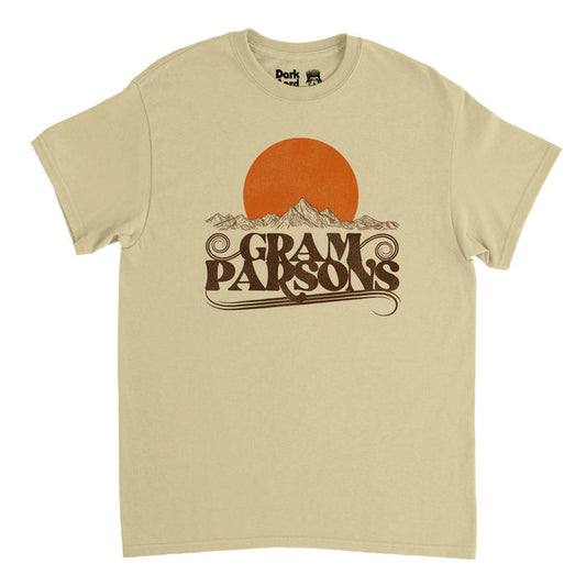 A light brown retro vintage t-shirt with a bright orange/yellow sun rising above a mountainous landscape, sketched with thin brown lines, and the name Gram Parsons in all caps. References the artist, singer, and songwriter named Ingram Cecil Conor III who recorded songs with famous bands including Flying Burrito Brothers, the Byrds, and International Submarine Band, and popularized "Cosmic American Music" and had hits like "Luxury Liner", "Do You Know How It Feels", and "Hickory Wind."