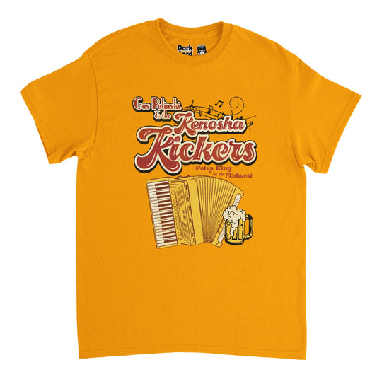 A bright yellow souvenir, tourist t-shirt in the style of the 1970s that says "Gus Polinski & the Kenosha Kickers" in bright red text, music notes streaming from the words, and the image of a yellow accordion and a mug of beer fizzing over under the words "Polska King of the Midwest". References the iconic character Gus Polinski, played by famous actor John Candy, in the 1990 American christmas comedy movie "Home Alone" starring Macaulay Culkin.