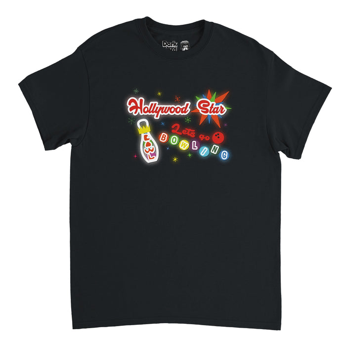 A retro, black colored 80s style short sleeved t-shirt that says "Hollywood Star" in red curved letters and "Let's go BOWLING" next to an image of a bowling ball and a graphic of a bowling pin with a crown that says "BOWL" all against a background of shiny colorful stars. References Hollywood Star Lanes, a bowling alley in LA where The Big Lebowski, a crime comedy movie, was filmed in 1998.