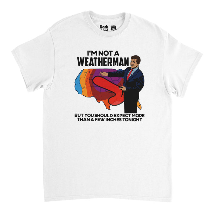 A vintage, 70s style white colored t-shirt that says "I'm Not A Weatherman But You Should Expect More Than A Few Inches Tonight" in black letters with the image of a brown haired weatherman wearing a suit and a red tie, pointing to a map of the United States with different colors, akin to a weather map, and the phallic shape of a storm, colored in red, coming from his pants.