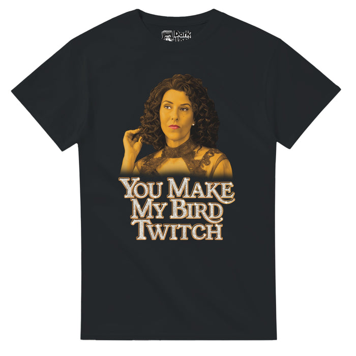 A vintage, 80s style black colored t-shirt that says "You Make my Bird Twitch" in sparkly white letters outlined in orange underneath an image of character Judy Gemstone in a yellowish tint with large brown curls. References the iconic quote "I like watching Jesse get in trouble. It makes my bird twitch" from the crime TV show "The Righteous Gemstones" by character Judy Gemstone played by Edi Patterson, the young Judy Gemstone played by Emma Shannon.