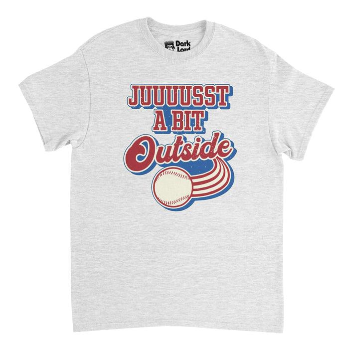A vintage, souvenir heather gray colored short sleeved t-shirt that says "Juuuusst a bit outside" in red, white, and blue text with the graphic of a baseball rushing past, red stripes flying out behind it. In reference to the iconic line said by character Harry Doyle the 1989 film "Major League", acted by the legendary Bob Ueker, dubbed "Mr. Baseball" and known for his role as announcer for the Milwaukee Brewers for 54 seasons.