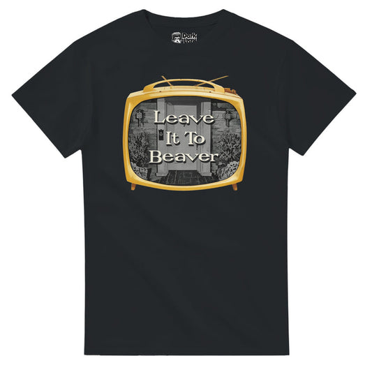 A black colored 70s style vintage short sleeved t-shirt with a golden retro box tv with a black and white image of the front door of a house with plants to each side that says "Leave It To Beaver" in white text in reference to the iconic 1950s and 1960s sitcom television show of the same name starring Tony Dow as Wally Cleaver, Jerry Mathers as Beaver Cleaver, Barbara Bilingsley as June Cleaver, and Hugh Beaumont and Ward Cleaver.