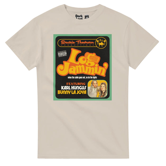 A retro, sand colored vintage off-white t-shirt that says "Log Jammin'" with a log image in the 'g', "when the cable goes out, so do the lights", "Featuring Karl Hungus, Bunny La Joya" and "Jackie Treehorn Productions" with a "Parental Advisory Explicit Content" warning. Includes the image of a graphic with camels and palm trees and an image of Karl Hungus or Uli Kunkel from The Nihilists (played by Peter Stormare) and Bunny Lebowski (played by Tara Reid) who starred in a porn video from The Big