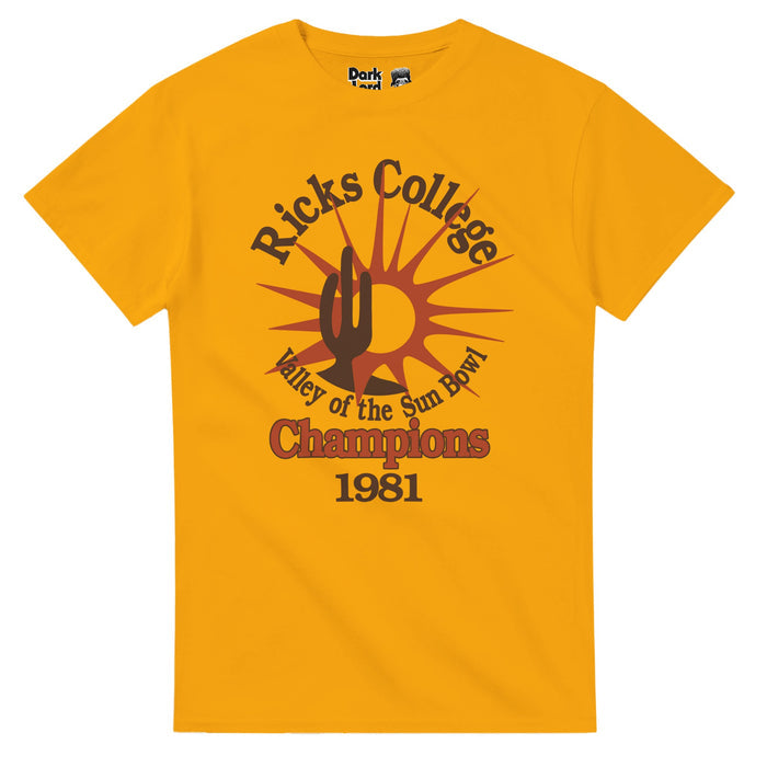 An 80s style, vintage short sleeved shirt in the color mustard yellow that says "Ricks College, Valley of the Sun Bowl Champions, 1981" with the emblem of a three pronged cactus with a spiky red sun.  A direct replica of the t-shirt worn by iconic character Napoleon Dynamite, portrayed by actor Jon Heder, in the indie coming of age film "Napoleon Dynamite" which takes place in Preston, Idaho.