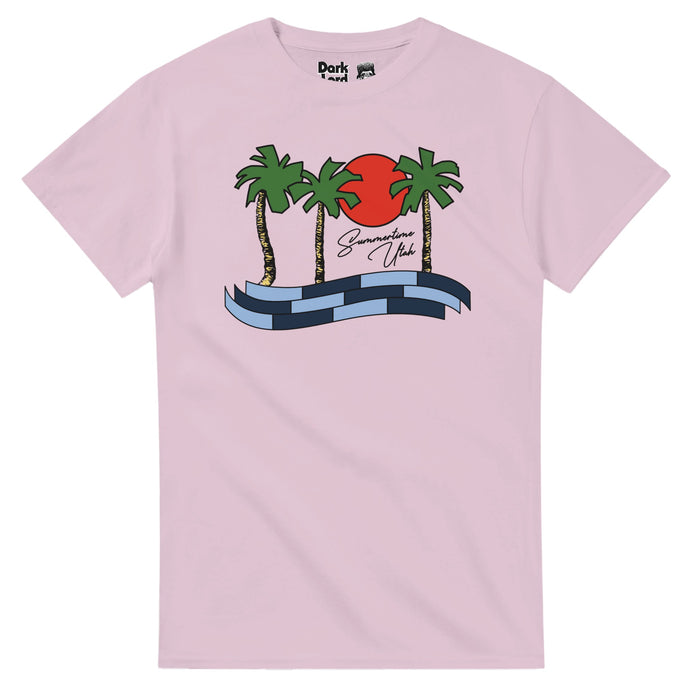 A vintage, light pink colored souvenir t-shirt with an graphic of palm trees, a bright red circular sun, and blue and navy block waves that says "Summertime Utah" in cursive letters. A replica of the t-shirt that character Napoleon Dynamite - played by actor Jon Heder - wore in the 2004 comedic indie film Napoleon Dynamite.
