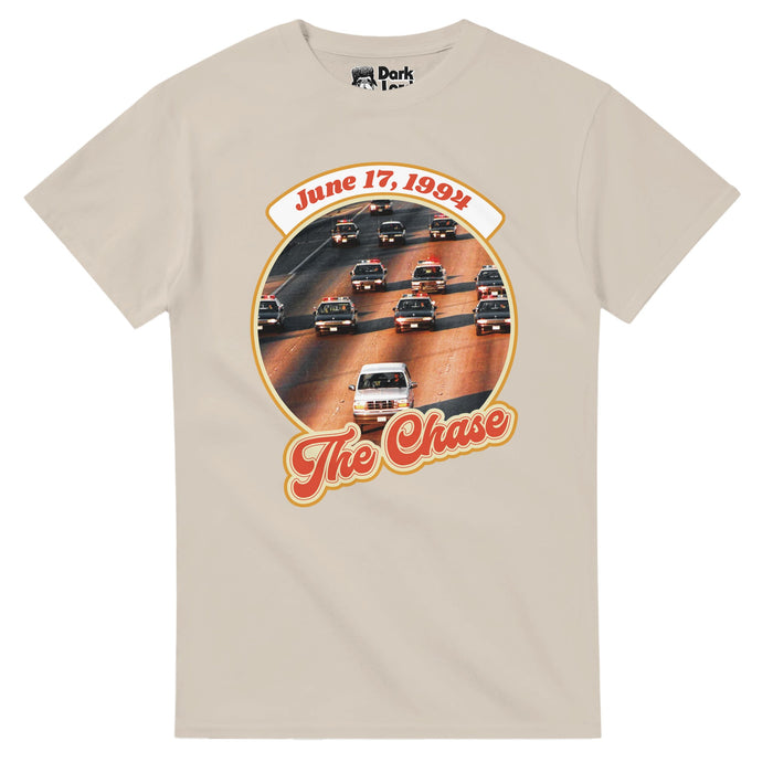 A retro, sand colored 80s style t-shirt that says "June 17, 1994" and "The Chase" in red letters with a circular graphic of multiple police cars chasing the Oxford White 1993 Ford Bronco of O.J. Simpson. References the 2010 documentary called "June 17, 1994" from ESPN's 30 for 30 series, about the events on the date of the police chase of O.J. Simpson, an NFL player, also known as "The Juice", famous for the murder trial following the deaths of his ex-wife, Nicole Brown Simpson, and Ronald Goldm