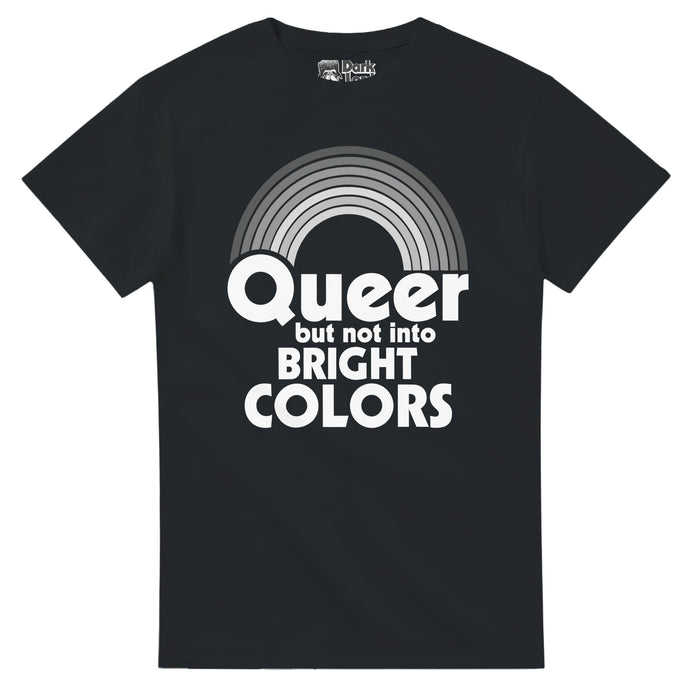 A vintage, 80s style LGBTQ+ pride and acceptance t-shirt in the color black that says in white bold text "Queer but not into BRIGHT COLORS" underneath an image of a seven striped rainbow in various shades of gray, a funny pun.
