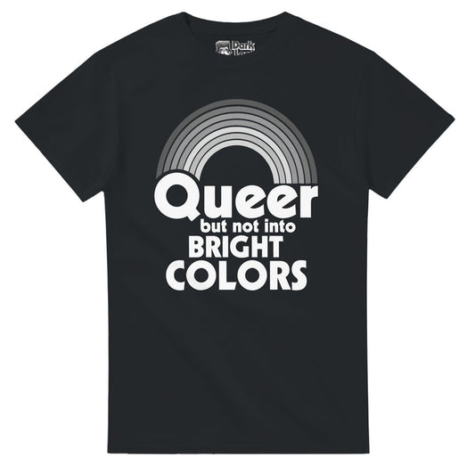 A vintage, 80s style LGBTQ+ pride and acceptance t-shirt in the color black that says in white bold text "Queer but not into BRIGHT COLORS" underneath an image of a seven striped rainbow in various shades of gray, a funny pun.