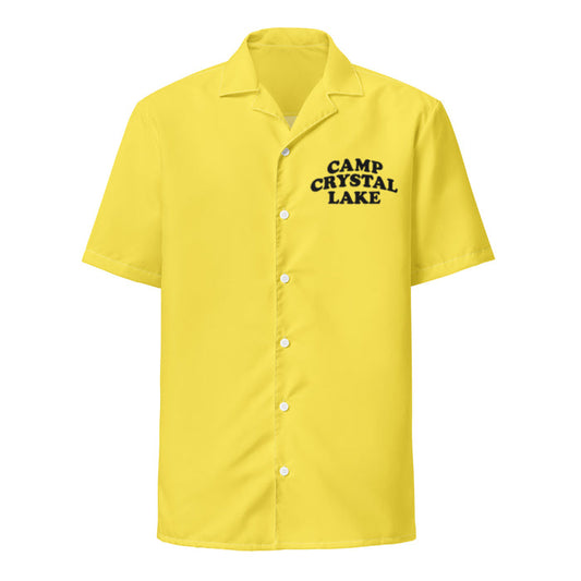 A vintage, souvenir Camp Crystal Lake yellow colored button up collared short sleeved shirt, referencing the cult horror thriller film "Friday the 13th", a perfect costume for the camp counselors in the movie who wore this very uniform when they were hunted and killed on the campgrounds.