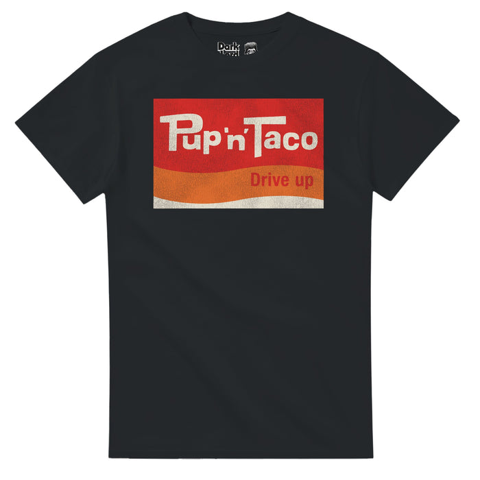A retro, vintage black colored t-shirt with the Pup 'n' Taco Drive Up logo of multiple block and wavy colors, red, orange, and white, in reference to the fast food restaurant founded in 1956 in Pasadena, California by Russell Wendell that was eventually sold to Taco Bell in 1984, although a couple locations survived in Albuquerque, New Mexico. Also known from the 1985 comedy "Fletch", the film "The Runaways", "America's Court with Judge Ross", and in the "Tonight Show with Johnny Carson."