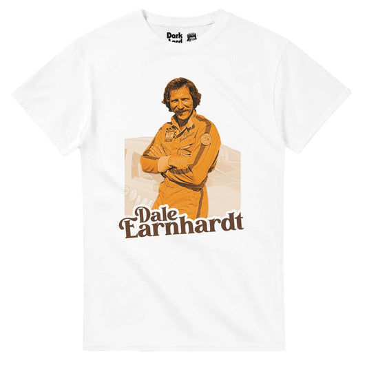 A vintage, 80s style souvenir Dale Earnhardt shirt with an image of the iconic race car driver wearing his uniform, his arms crossed over his chest, leaning against a car, the image in a yellow tone. References the professional stock car driver and NASCAR racer, often driving his No. 3 Chevrolet for Richard Childress Racing, with iconic nicknames like "Ironhead" or "the Intimidator", known as one of the greatest race car drivers of all time.