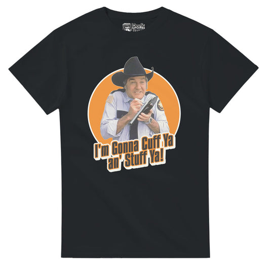 A retro, 80s style t-shirt in the color black that says "I'm Gonna Cuff Ya an' Stuff Ya!" underneath an image of Sheriff Rosco P. Coltrane wearing his black sheriff hat and light blue police officer uniform, holding a pen to his investigative notebook. References the action television series "The Dukes of Hazzard" starrying Catherine Bach, Jon Scheider, Tom Wopat, and James Best as Rosco who says the iconic quote "FREEZE! I'm gonna cuff ya an' stuff ya! Ya dun scuffed my vehicle! Say Hello from