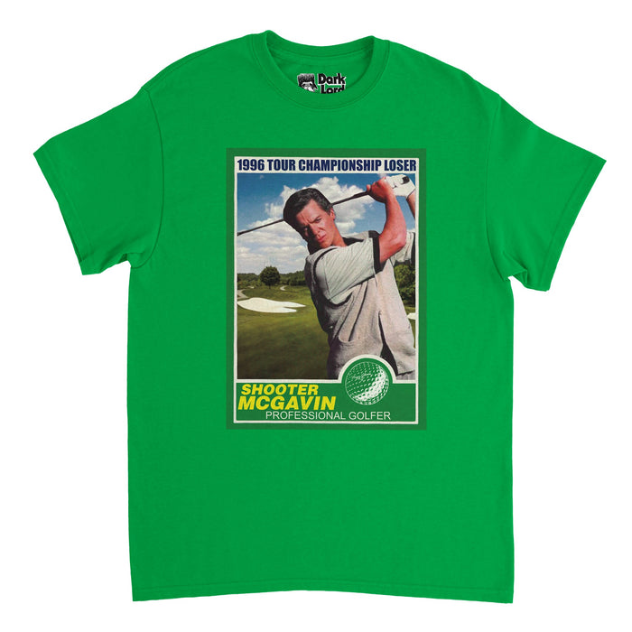 A retro, irish green colored souvenir t-shirt with a rectangular dark green box that says "1996 Tour Championship Loser" and "Shooter McGavin", "Professional Golfer", surrounding an image of a golfer swinging his golf club on a green driving range and the image of a golf ball graphic. References the 1996 sports comedy film Happy Gilmore and the antagonist character Shooter McGavin, played by iconic actor Christopher McDonald.