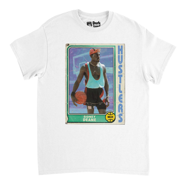 A retro, 70s style souvenir t-shirt in the color white that says "Hustlers" and "Sidney Dean" with the graphic of a basket that says "Baller" and an image of the iconic character Sidney Deane played by Wesley Snipes  from the 1992 sports comedy movie "White Men Can't Jump", also starring Woody Harrelson.