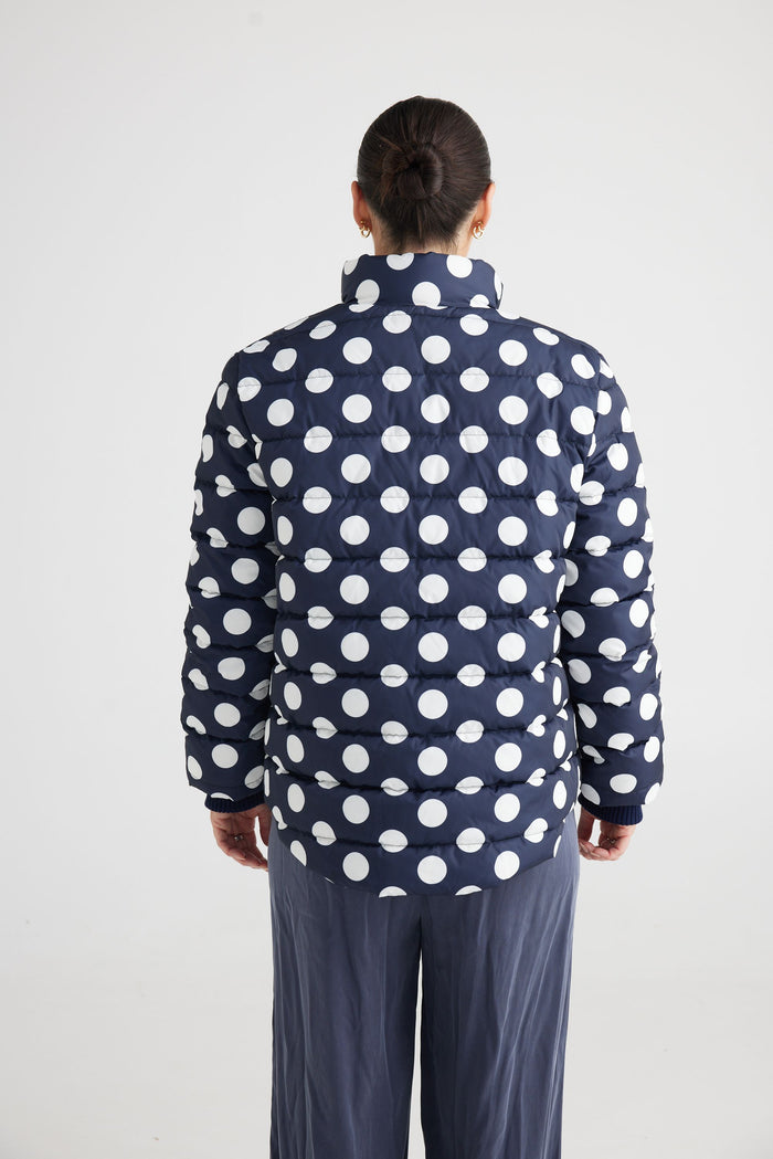 quilted puffer jacket featuring a Navy Spot print