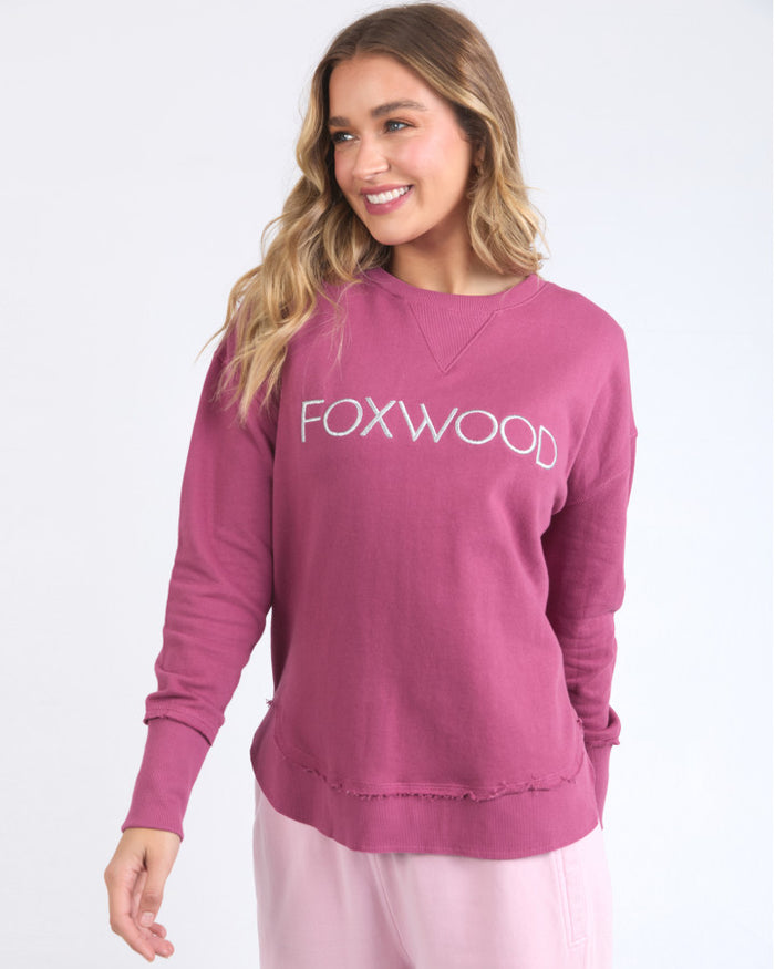 pink women’s sweatshirt with silver FOXWOOD logo