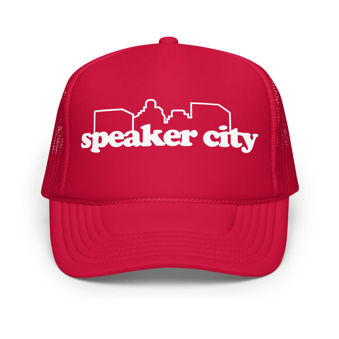 A vintage bright red colored souvenir "speaker city" trucker hat with the image of the outline of a city skyline. References the hat worn by Beanie in the classic comedic film 'Old School', played by famous actor Vince Vaughn.