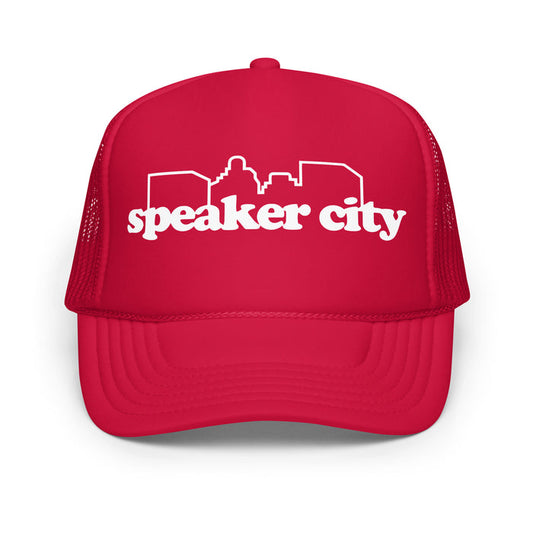 A vintage bright red colored souvenir "speaker city" trucker hat with the image of the outline of a city skyline. References the hat worn by Beanie in the classic comedic film 'Old School', played by famous actor Vince Vaughn.