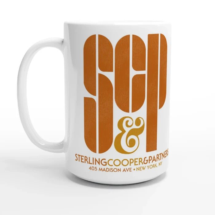 A retro, white colored souvenir SC&P mug that says "Sterling Cooper & Partners" located at "405 Madison Ave, New York, NY" in shades of orange and yellow. References the advertising agency formed in 1968 from the drama television series "Mad Men" starring actor Jon Hamm as Don Draper and Elisabeth Moss as Peggy Olson.