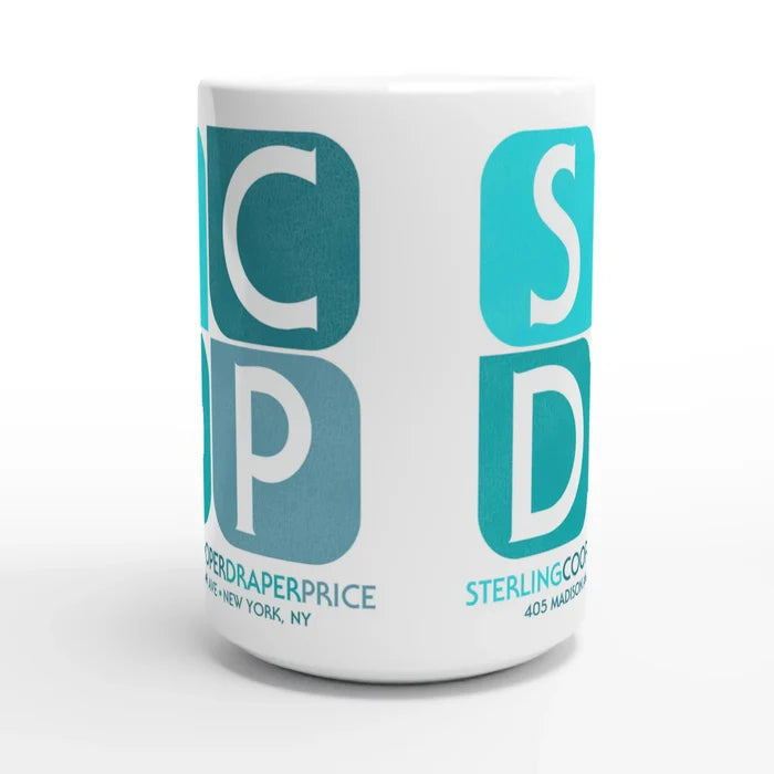 The side of a vintage, white colored 80s style mug with the emblem of SCDP, Sterling Cooper Draper Pryce, a firm from the dramatic television series "Mad Men" which ran from 2007-2015 and starred Don Draper (played by Actor Jon Hamm). The address of SCDP is 405 Madison Ave, New York, NY, as Madison Avenue was the home of multiple important advertising firms.