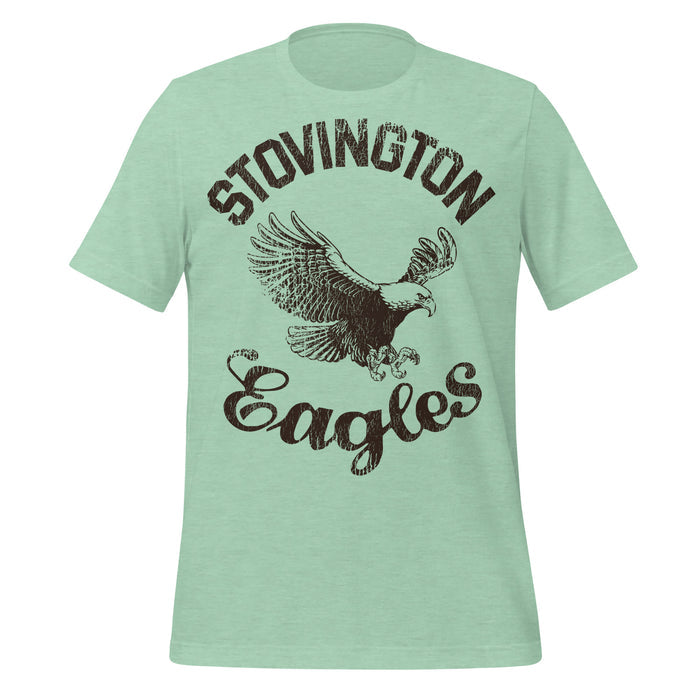 A mint green colored retro, 70s style t-shirt that says "Stovington Eagles" with the image of an American bald eagle at the center. References the iconic horror film "The Shining" based on the Stephen King novel, in which character Jack Torrance, played by Jack Nicholson, wears this shirt due to his old days teaching at Stovington Preparatory School in Vermont.