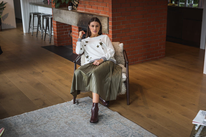 Women's cream sweatshirt with olive star print