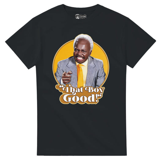A black colored, 70s style retro t-shirt that says "That Boy Good!" underneath an image of actor Clint Smith wearing a blue suit and yellow tie, smiling against a circular yellow background. References the 1988 comedy romance film "Coming to America" and a short clip in which the character Sweets, played by Clint Smith, says "That Boy Good!" in excitement to see Randy Watson, played by Eddie Murphy, the iconic soul singer.