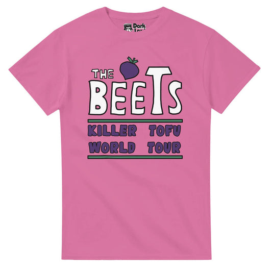 A pink colored retro 80s style short sleeved t-shirt with the graphic of a small purple beet next to the words "The Beets" in white bubble letters, referencing the iconic band from the animated sitcom television series "Doug", and "Killer Tofu World Tour" in purple bubble letters, with green lines above and below the words, referencing the band's hit song "Killer Tofu". The Beets is a parody of The Beatles and is known as one of the best fictional TV cartoon bands.