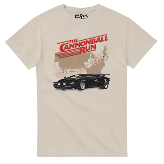 A sand colored 70s style t-shirt that says "The Cannonball Run" in red text with red lines, a graphic map of the United States with a red trail marked from Connecticut to California, and a black Lamborghini car. References the comedic action movie The Cannonball Run, popular in the 1980s, about the outlaw cross country road race called Cannonball Baker Sea-To-Shining-Sea Memorial Trophy Dash, with famous actors like Jacki Chan, Farrah Fawcett, Dom DeLuise, Burt Reyolds, and Roger More.