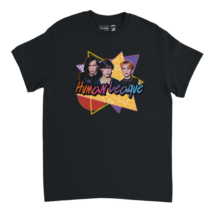A black colored, vintage 90s style short sleeved t-shirt that says "The Human League" in various colors, orange, pink, blue, and purple, over the image of three iconic band members with alternative haircuts and colorful makeup, over the top of multiple triangles and circles with patterns in yellows, purples, and reds. References the iconic English synth band first created in Sheffield, with many members including Philip Oakey, Joanne Catherall, and Susan Ann Sulley, made famous by their album Da